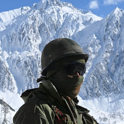 An Indian army soldier near Zojila mountain pass, which connects Srinagar to Ladakh. Photo: AFP