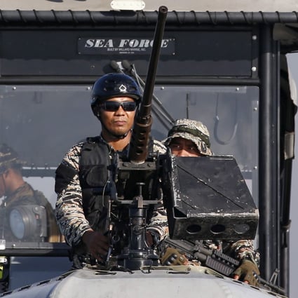 Members of Philippine Navy on patrol in Manila Bay. Photo: Reuters