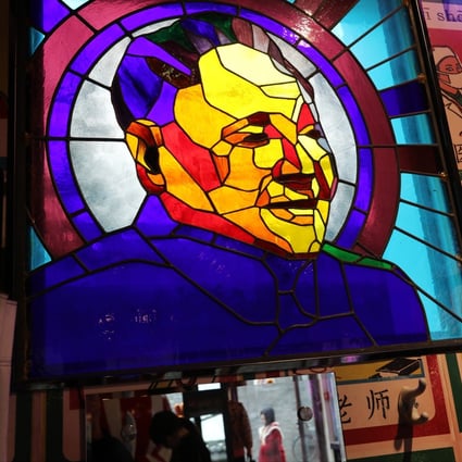 A stained glass window bears the image of late Chinese leader Deng Xiaoping at a shop at Nanluoguxiang, one of the oldest alleyways in Beijing, on December 17. Deng said in 1984 that “patriots governing Hong Kong” must underpin the “one country, two systems” principle after the city’s return to Chinese sovereignty. The catchphrase is gaining currency amid the currently politically fractured landscape. Photo: Simon Song