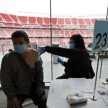 A man gets a Covid-19 vaccine shot at Levi's Stadium in Santa Clara, California. Photo: AFP