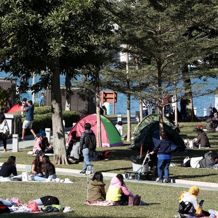People enjoy a sunny day at Tamar Park, Admiralty, on January 21. Photo: Jonathan Wong