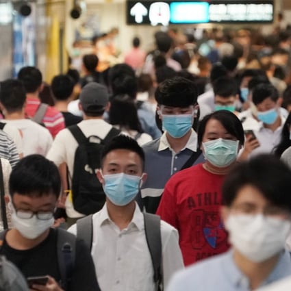 Morning commuters change platforms on the East Rail Line on July 14, 2020, as Hong Kong battled its third wave of coronavirus infections. New nine-car trains were introduced on the line on February 6, 2021, amid the city’s fourth wave of Covid-19. Photo: Felix Wong