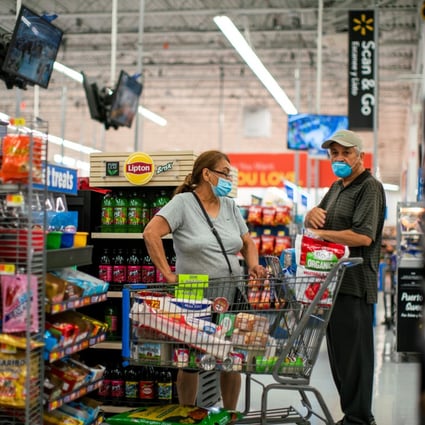 Shoppers stock up on provisions at a Walmart store, in New Jersey, in July 2020. There is a lot of pent-up demand in the household and business sectors which should support spending once infection rates are lower. Photo: Reuters