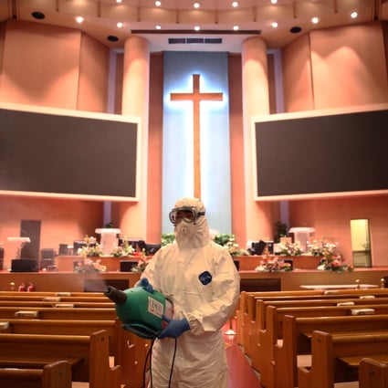 A disinfection worker at the Yoido Full Gospel Church in South Korea amid concerns over the spread of the coronavirus. Photo: Getty Images