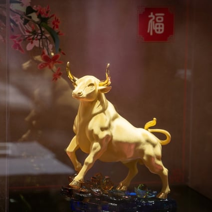 A gold ox figurine on display at a Luk Fook Holdings International jewellery store in Beijing. Photo: Bloomberg