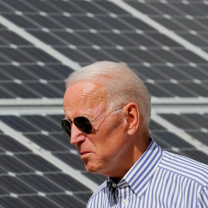 Joe Biden, then US presidential candidate, walks past solar panels while touring the Plymouth Area Renewable Energy Initiative in Plymouth, New Hampshire, on June 4, 2019. Photo: Reuters
