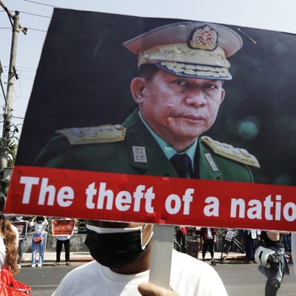 Protesters hold placards with pictures of military junta chief General Min Aung Hlaing, left, Chinese President Xi Jinping, second right and Russian President Vladimir Putin in Yangon, Myanmar on Saturday. Photo: EPA-EFE
