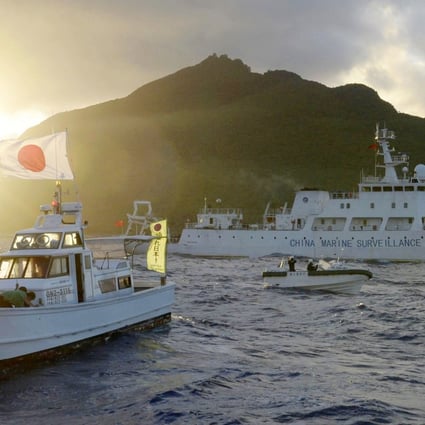 A Chinese maritime surveillance vessel (right) passes near the Senkaku Islands in the East China Sea in 2013. Photo: Kyodo