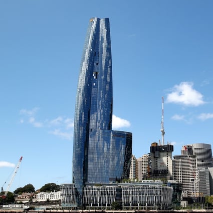 The Crown Resorts Barangaroo South luxury hotel resort and One Barangaroo Crown residences development on the Sydney harbour. The opening of its landmark casino hangs in the balance after a damning report found it is not fit to hold a gaming licence. Photo: Bloomberg