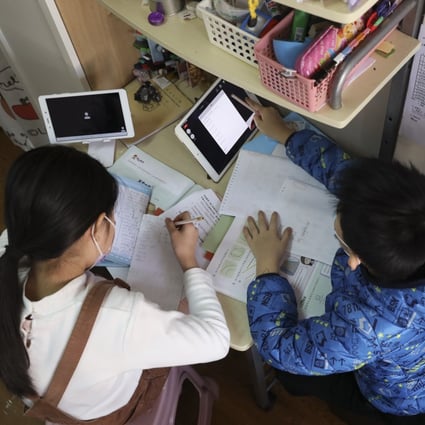 Students from a low-income family study via an online class at home in Tsuen Wan amid the coronavirus pandemic on January 18. Photo: K.Y. Cheng