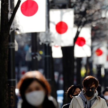 Pedestrians make their way through the Ginza shopping district in Tokyo. In contrast to the West, inflation expectations in Japan remain stubbornly subdued despite the Bank of Japan’s accommodative monetary policy. Photo: Reuters