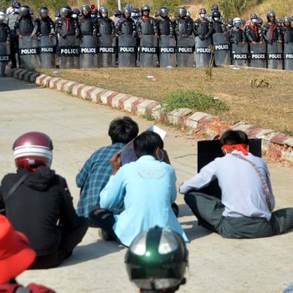 Riot police stand guard near a prison during a demonstration by protesters against the military coup in Naypyidaw on Monday. Photo: AFP