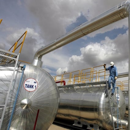 A Cairn India employee works at a storage facility for crude oil at the Mangala oil field in 2009. Photo: Reuters