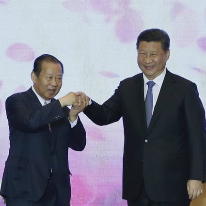 China’s President Xi Jinping holds hands with Toshihiro Nikai from Japan’s Liberal Democratic Party during a 2015 China-Japan friendship exchange meeting in Beijing. Photo: Reuters
