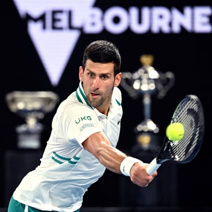 Novak Djokovic reaches to hit a return against Aslan Karatsev in their Australian Open semi-final on Thursday. Photo: Photo: EPA
