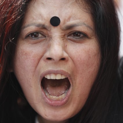 A Nepali activist takes part in a protest in Kathmandu on February 12 calling for the scrapping of a proposed law that would restrict travel for many women. Photo: AP