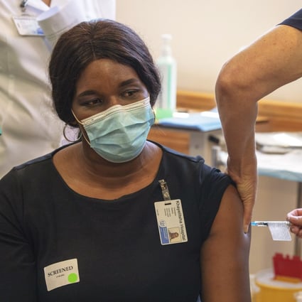 A health care worker receives the Johnson & Johnson Covid-19 vaccine in Cape Town, South Africa, on February 17. The vaccine has been approved by South African Health Products Authority and is expected to only be given to health care workers. Photo: EPA-EFE