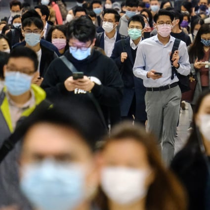 Commuters walk through Central MTR station in Hong Kong on February 18. The government must not only provide budget relief for Hongkongers in need, it must also take this pandemic as an opportunity to ride on the ESG trend, to provide a solid foundation for Hong Kong’s economic recovery. Photo: Bloomberg