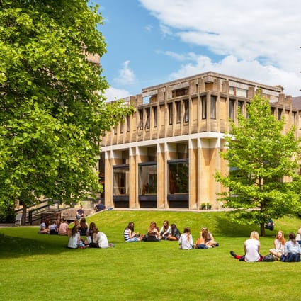 Students sit on the lawn outside Balliol College at Oxford University. Photo: Shutterstock
