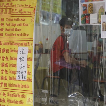 A cleaning worker sits at a food outlet in Yau Ma Tei, Hong Kong, on February 2. All work deserves its own dignity. The present minimum wage is undignified – it belittles us all. Photo: Nora Tam