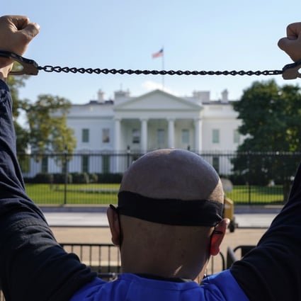 A member of the Uygur American Association demonstrating in October in front of the White House in support of the Uygur Forced Labour Prevention Act, which has been reintroduced in both chambers of the US Congress. Photo: AP