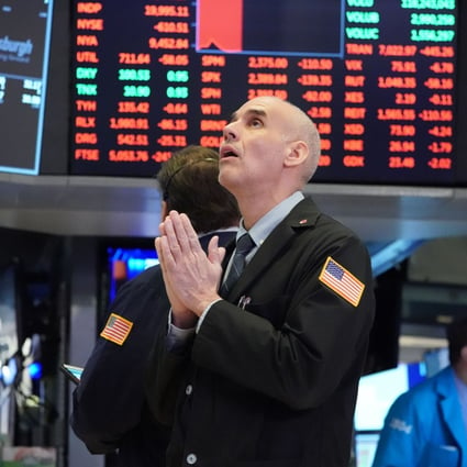 Traders at the New York Stock Exchange on March 18, 2020. US companies’ earnings are beating expectations, alleviating some of the concerns around elevated metrics such as forward price-to-earnings ratios. Photo: AFP