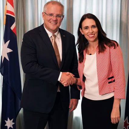 Australian Prime Minister Scott Morrison shakes hands with his New Zealand counterpart Jacinda Ardern in Auckland. File photo: AFP