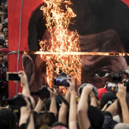 Activists burn an effigy during a September 2017 protest in Manila against Philippine President Rodrigo Duterte’s drug war killings. Photo: AFP