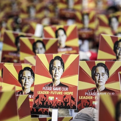 Catholic supporters of Aung San Suu Kyi display placards during a protest against the coup in Myanmar outside the Chinese embassy in Yangon on Sunday. Photo: EPA
