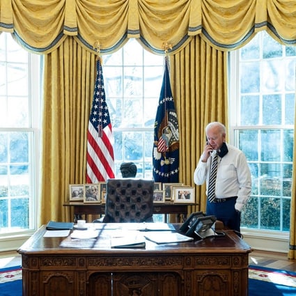 President Joe Biden talks on the phone in the Oval Office of the White House on January 22. The days of US allies giving Washington blank-cheque support are over. Photo: White House / Zuma Wire/ zumapress.com