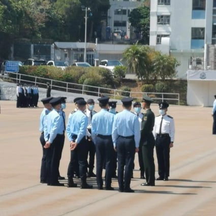 PLA soldiers deliver marching training to police officers at the parade ground in Wong Chuk Hang. Photo: Handout