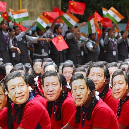 Indian students in Chennai wearing masks of President Xi Jinping of China as others wave national flags of India and China, ahead of Xi’s informal summit with Indian Prime Minister Narendra Modi in October 2019. Photo: Reuters