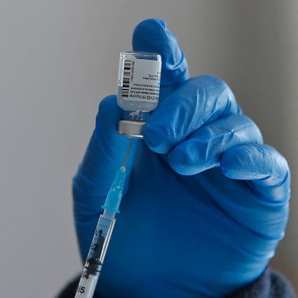 A health worker prepares a dose of the Pfizer-BioNtech Covid-19 coronavirus vaccine at a mobile clinic in Israel. Photo: AFP