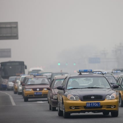 Taxis and traffic in a Beijing main street. China is the world’s biggest emitter of carbon dioxide, generating more than the US and Europe combined. Photo: Getty Images