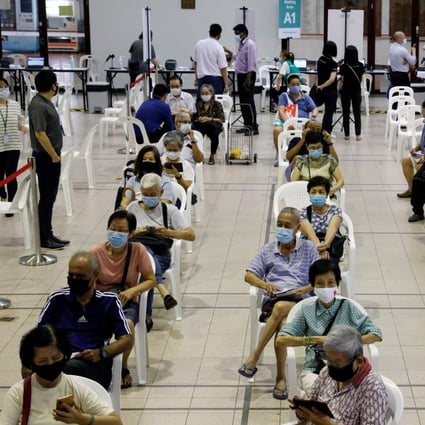 Elderly Singaporeans await their coronavirus shots at a vaccination centre in the city state. Photo: Reuters