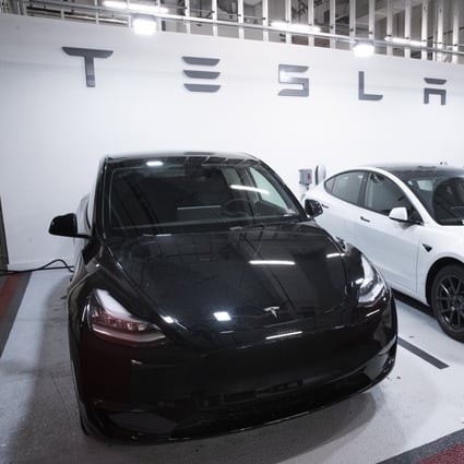 A Tesla Model 3 vehicle, centre, flanked by two Model Y cars. Photo: EPA-EFE