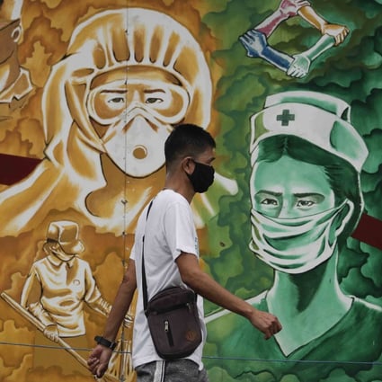 A mural outside the Mission Hospital in Pasig, Philippines, pays tribute to health workers. Photo: AP