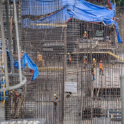 Workers on a construction site in Borikhamxay Province, Laos, August 19, 2020. Photo: Xinhua