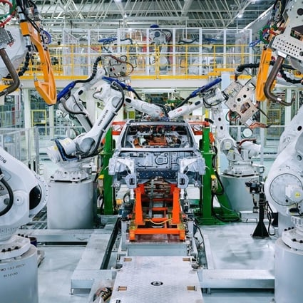 Xpeng’s new factory in the Guangdong provincial city of Zhaoqing touts 100 per cent automation for installation of car bodies at its welding workshops, with over 200 robotic arms. Photo: SCMP