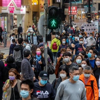 Pedestrians in the Causeway Bay district of Hong Kong on Saturday, December 12, 2020. Photo: Bloomberg