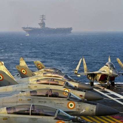 Indian fighter jets on the deck on an aircraft carrier during the Malabar naval exercise, which includes forces from Australia, Japan and the United States. Photo: AFP