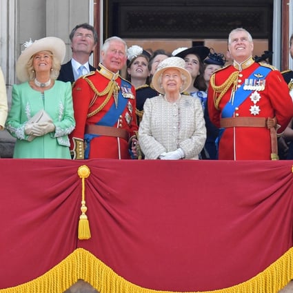 Britain’s Queen Elizabeth, flanked by her sons Prince Charles and Prince Andrew, pictured alongside other members of the UK royal family standing on a balcony at Buckingham Palace to watch a fly-past in 2019. Photo: AFP