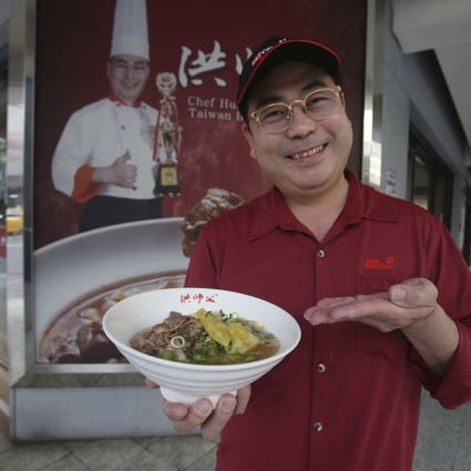 Chef Hung Ching Lung shows off his new pineapple beef noodle dish. Photo: AP