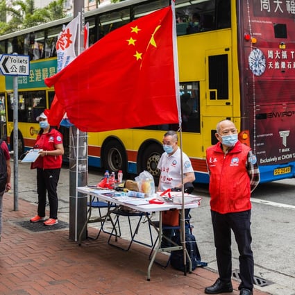 China’s national flag is displayed at a stall in Hong Kong where residents can sign in favour of changes to the local electoral system. Photo: AFP
