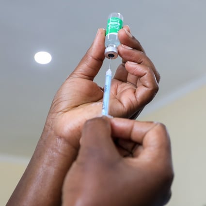 A Kenyan health care worker prepares to administer a dose of the Oxford/AstraZeneca Covid-19 vaccine. Many poorer countries are far behind Western nations in their roll-out programmes, being unable to purchase vaccines at the same scale and price. Photo: EPA-EFE