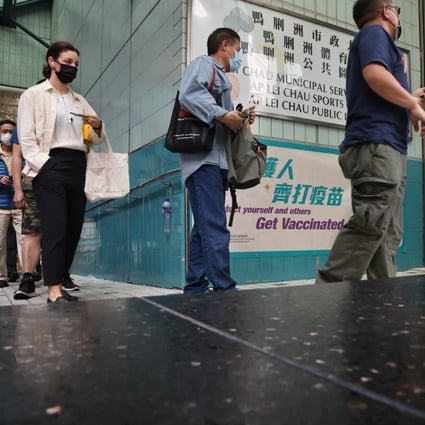 Members of the public queue for a BioNTech jab at the Ap Lei Chau Sports Centre. Photo: K. Y. Cheng