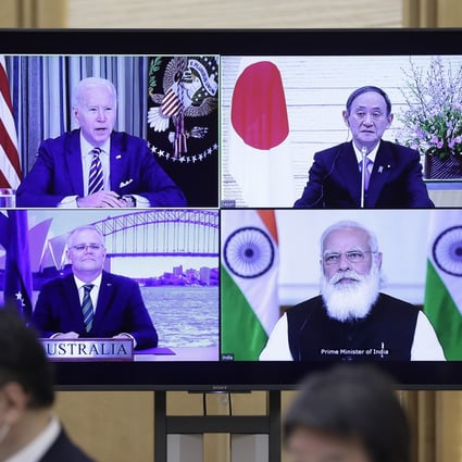 A monitor in Tokyo displays the virtual ‘Quad’ meeting of (clockwise from top left) US President Joe Biden, Japan’s Prime Minister Yoshihide Suga, India’s Prime Minister Narendra Modi and Australia’s Prime Minister Scott Morrison. Photo: Bloomberg