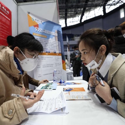 A Chinese jobseeker is interviewed at a career fair in Wuhan, Hubei province, this month. Economists are divided over whether the country is headed for a period of stagflation. Photo: AFP