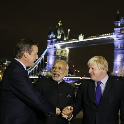 Indian Prime Minister Narendra Modi, centre, during his 2015 visit to Britain, where he met Boris Johnson, right, who was then the mayor of London. Johnson will now visit India as the British prime minister next month. Photo: AP