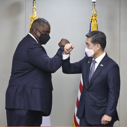US Secretary of Defence Lloyd Austin (left) bumps fists with his South Korean counterpart Suh Wook before their meeting in Seoul. Photo: EPA